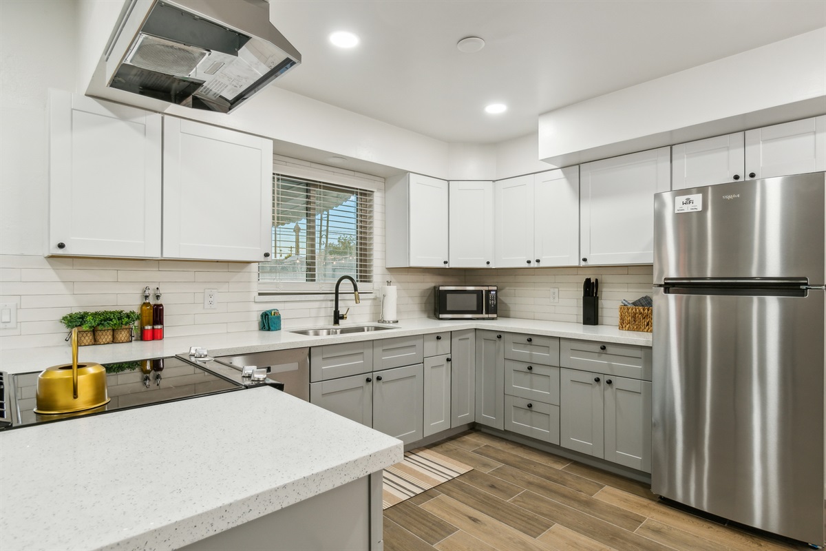 Save $ by cooking at home in this newly remodeled kitchen complete with quartz counters, new shaker cabinets and brand new stainless steel appliances.