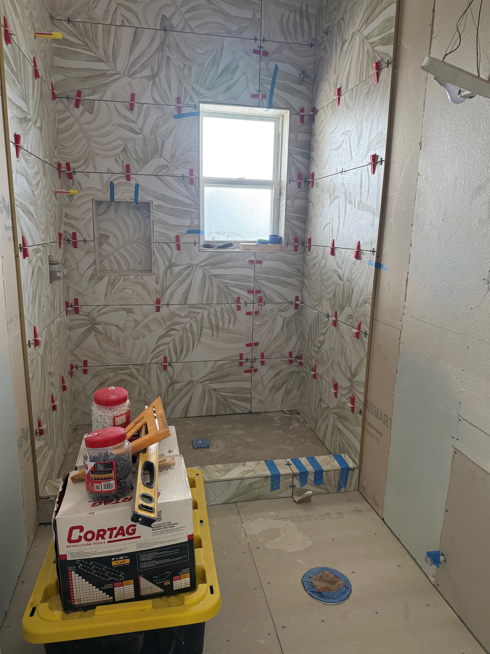 A half bath is being converted to a full bathroom 