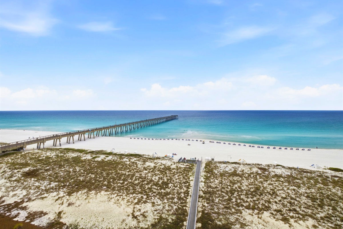 Soft white sand, emerald water, and endless beach views make this balcony feel like your own private escape.