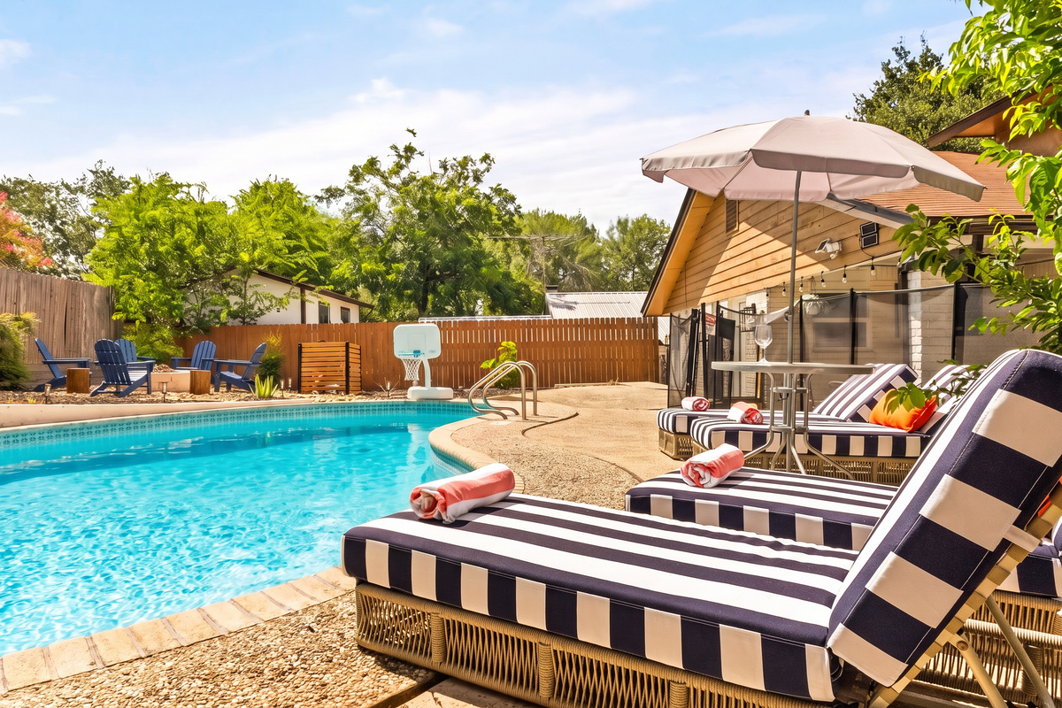 Stretch out and enjoy resort-style relaxation by the pool.