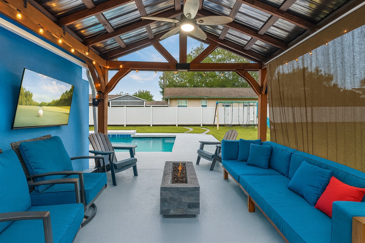 Backyard awning with TV and firepit