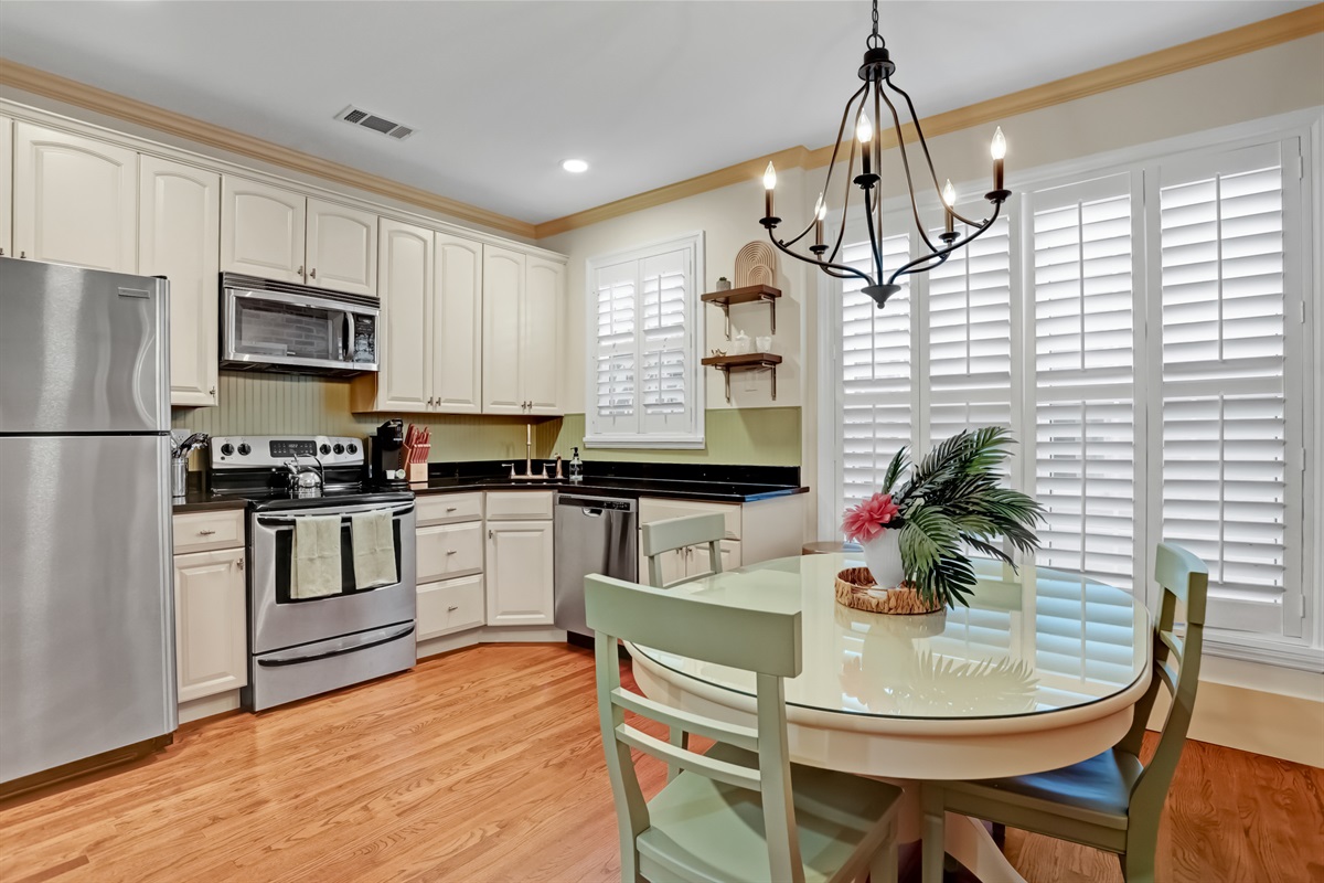 Enjoy meals steps from the fully equipped kitchen in this airy layout.