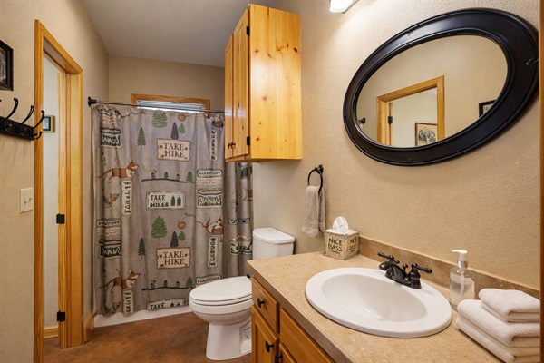 Ensuite bathroom with tub/shower combo — private access from bedroom + hallway.