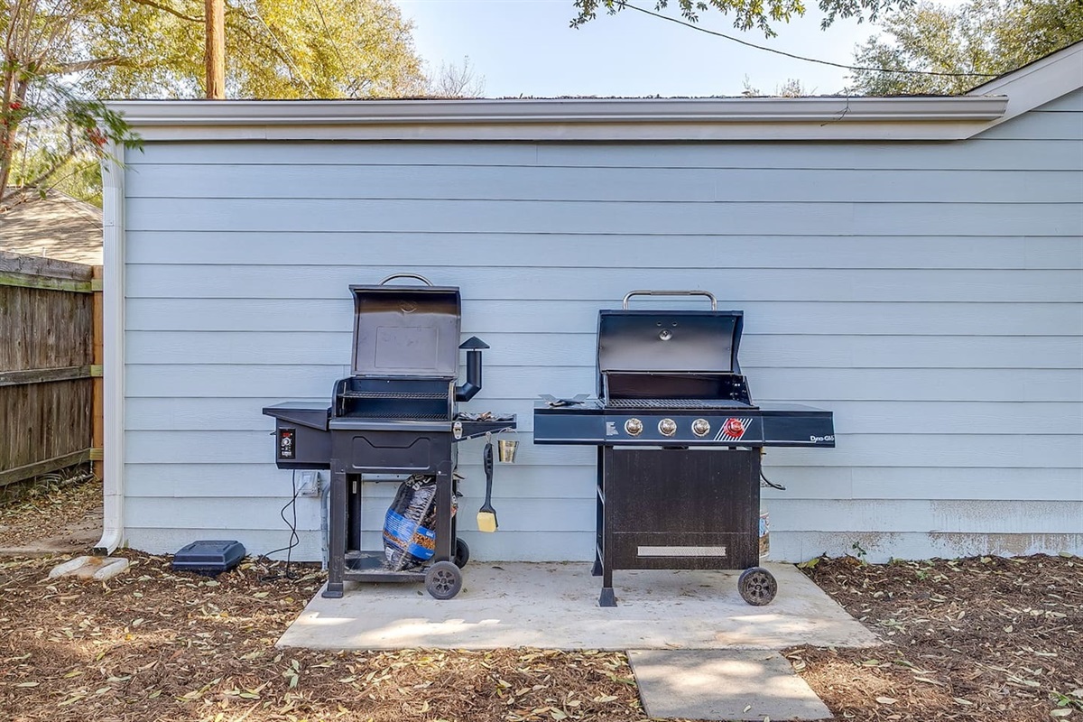 Outdoor grill station with propane grill and electric smoker