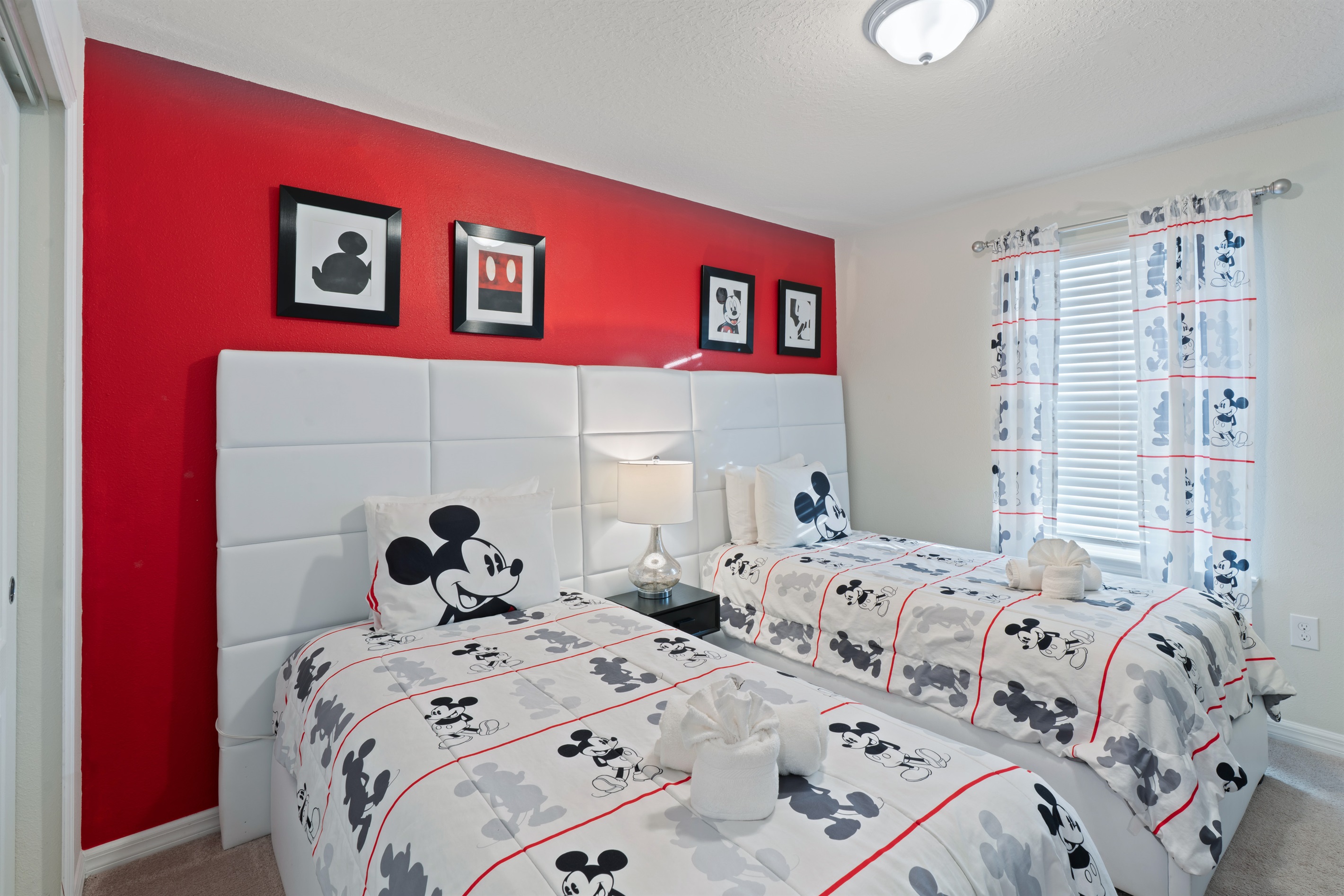 The Mickey Room is perfect for kids, featuring two comfy twin beds, a Smart TV for entertainment, a storage chest, and a spacious closet for all their belongings.