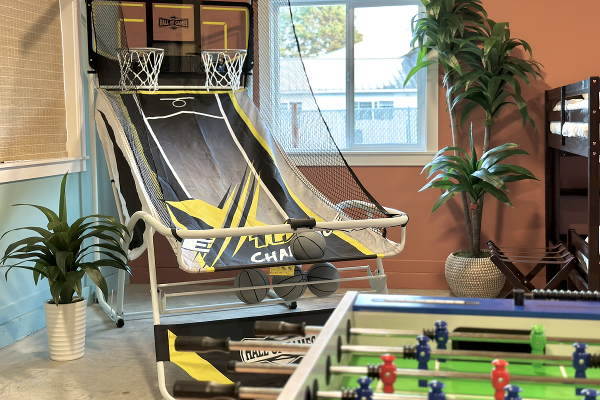 Arcade basketball, tucked into the Flamingo Fun Room downstairs — first one to 21 wins.