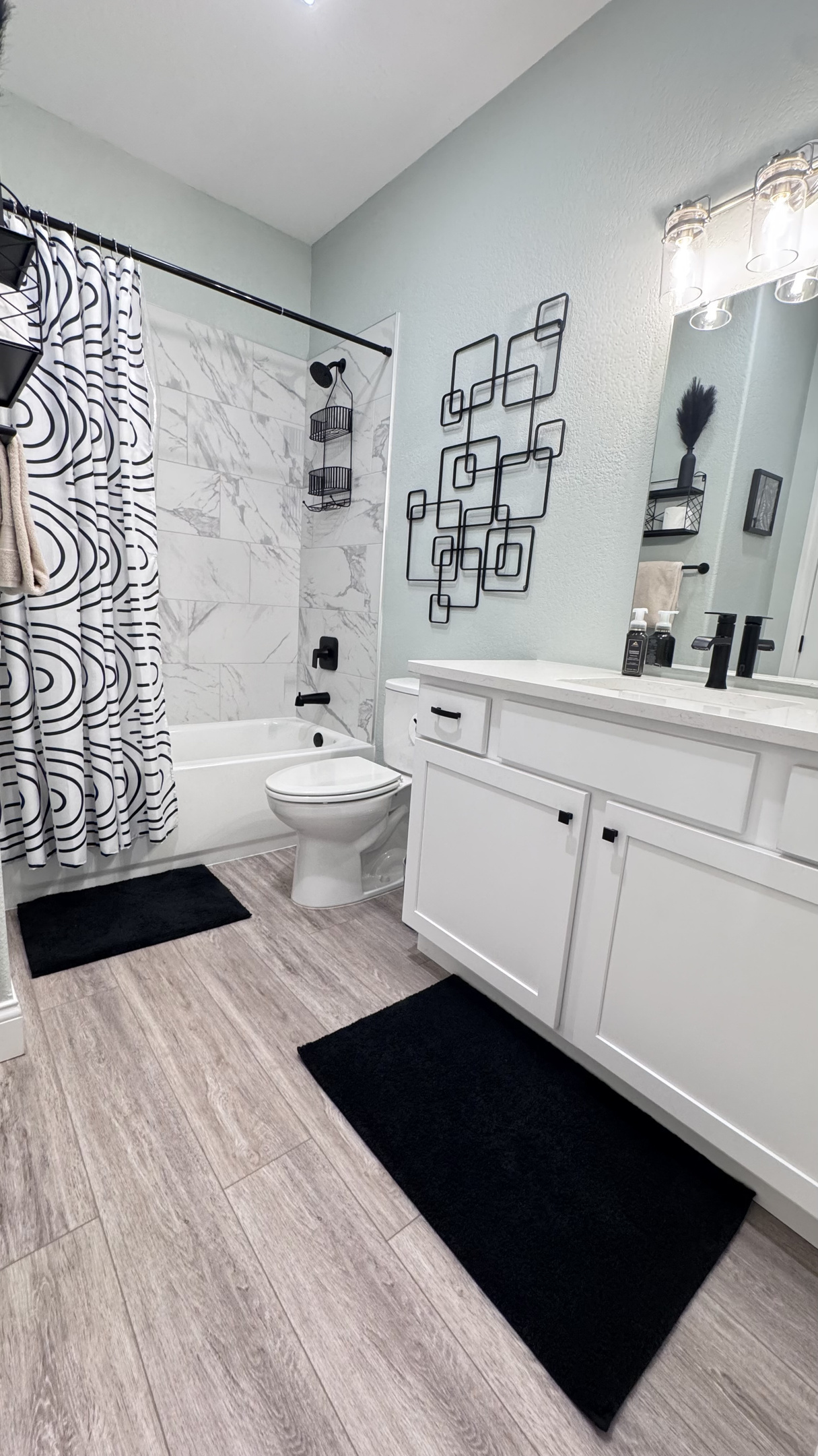 Shower-Tub combination with toilet, sink, towels, and toiletries. Bedroom 2 has private access or you may obtain access from the hallway.