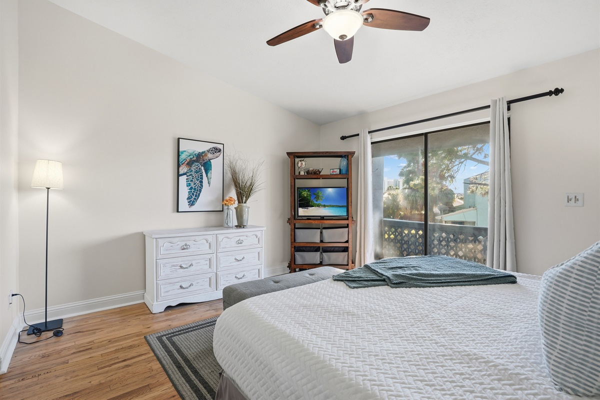 Bedroom #1 with King Bed and Balcony Access Overlooking the Back Yard