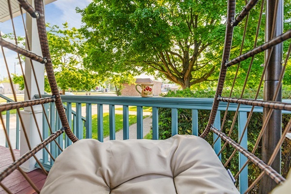 Sink into the cozy swing chair and savor your morning coffee surrounded by peaceful garden serenity