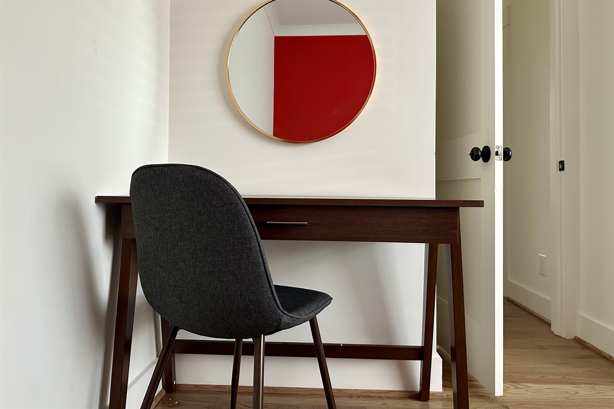 Dedicated workspace downstairs near the half bath and kitchen. Close the door and get some work done, if you must.