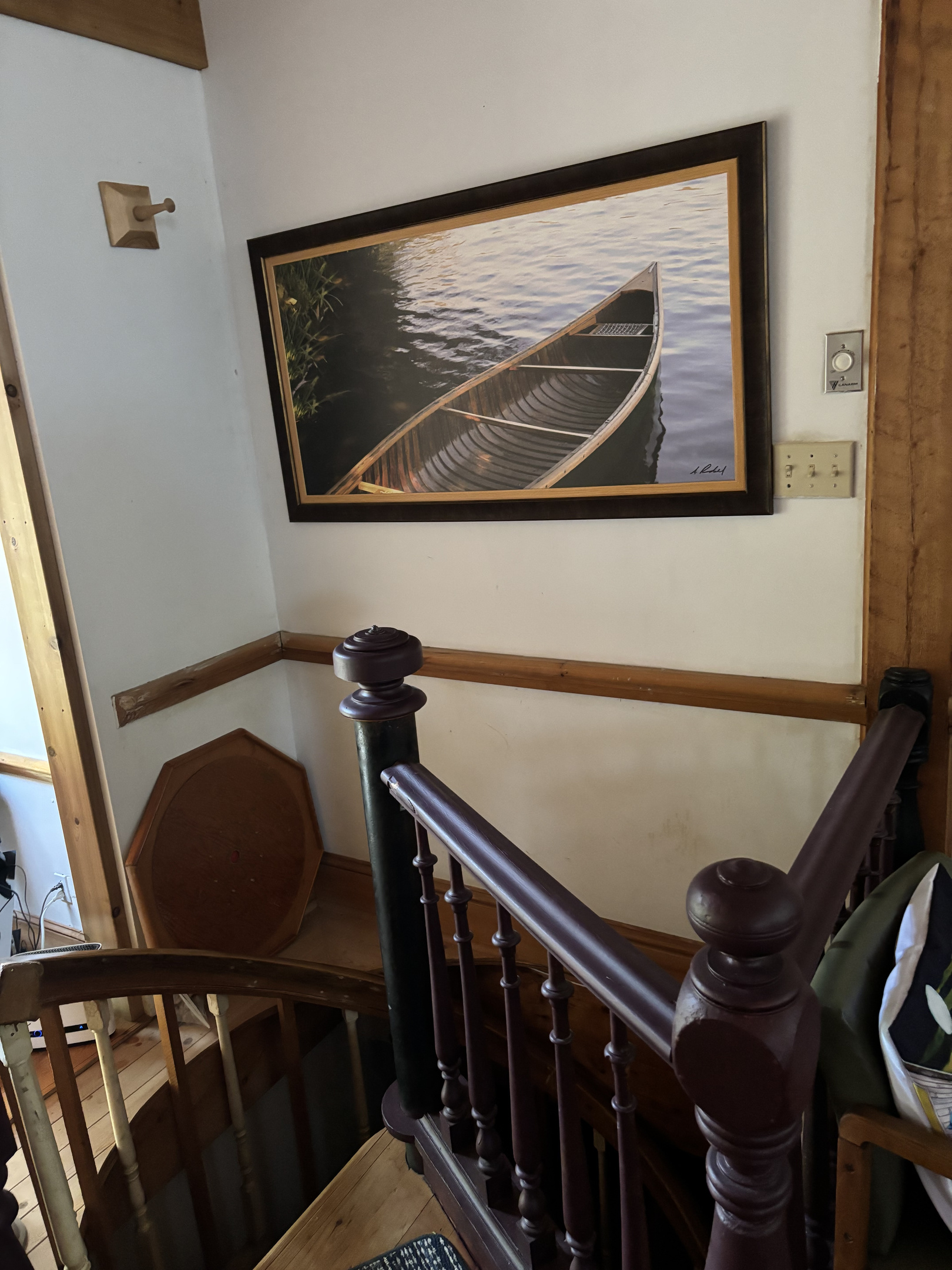 Upper end of spiral stairway from kitchen to lower level