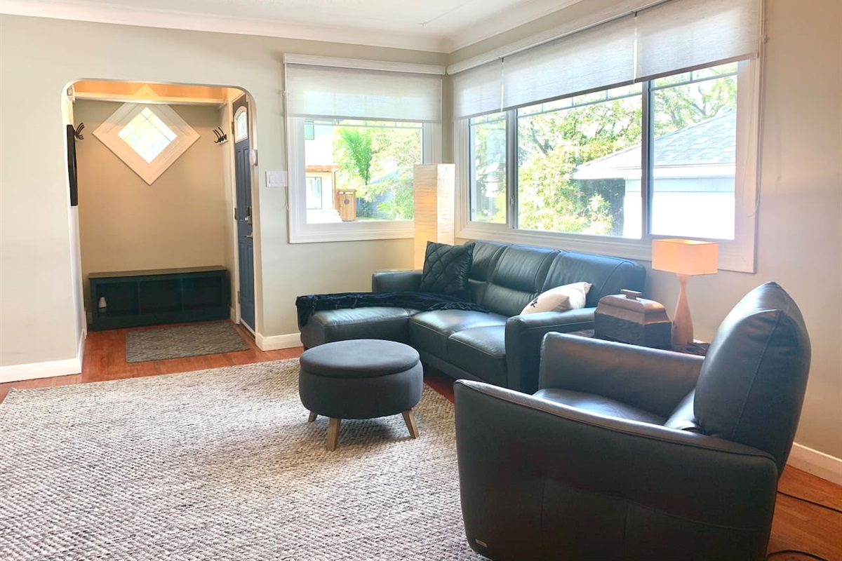 Lounge Area with Smart TV · Quality furnishings including an electric recliner.