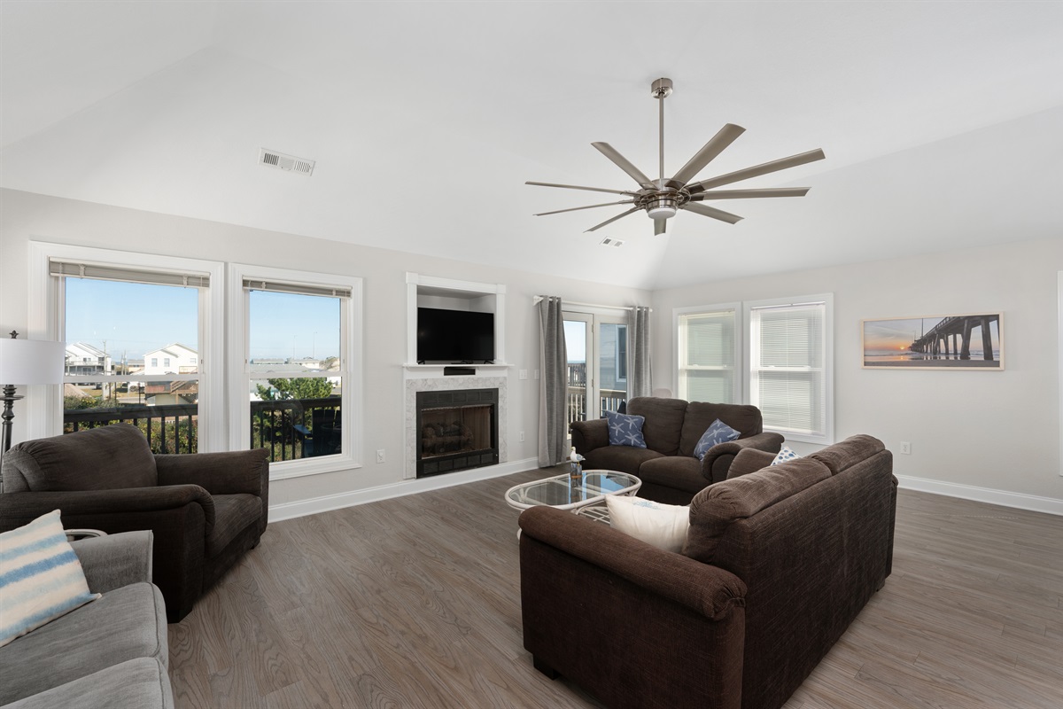 Cozy gathering space, open to kitchen and dining.