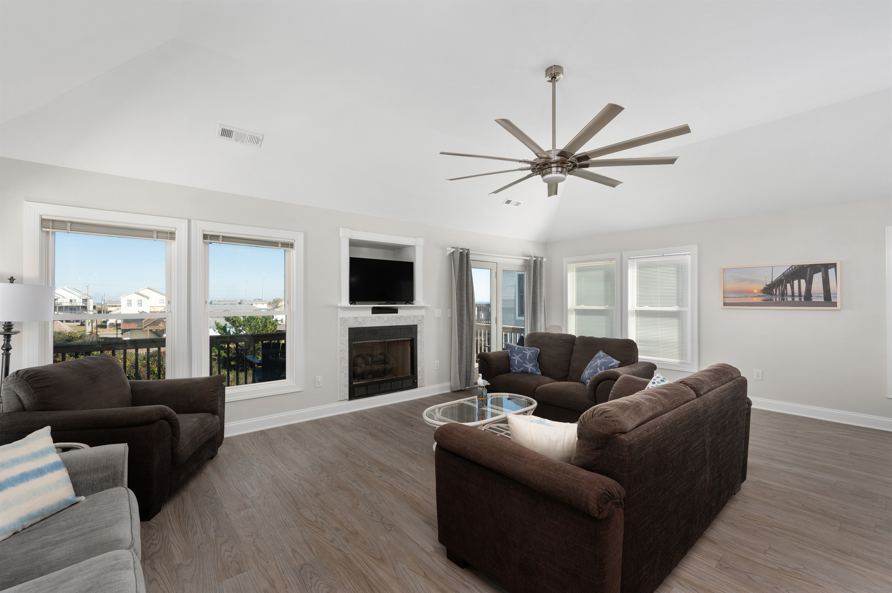 Cozy gathering space, open to kitchen and dining.