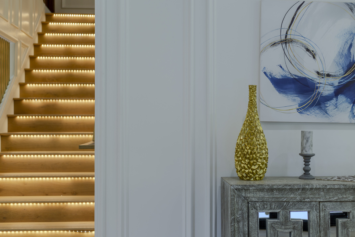 A beautifully designed staircase makes a stunning statement and adds character to this stylish retreat.