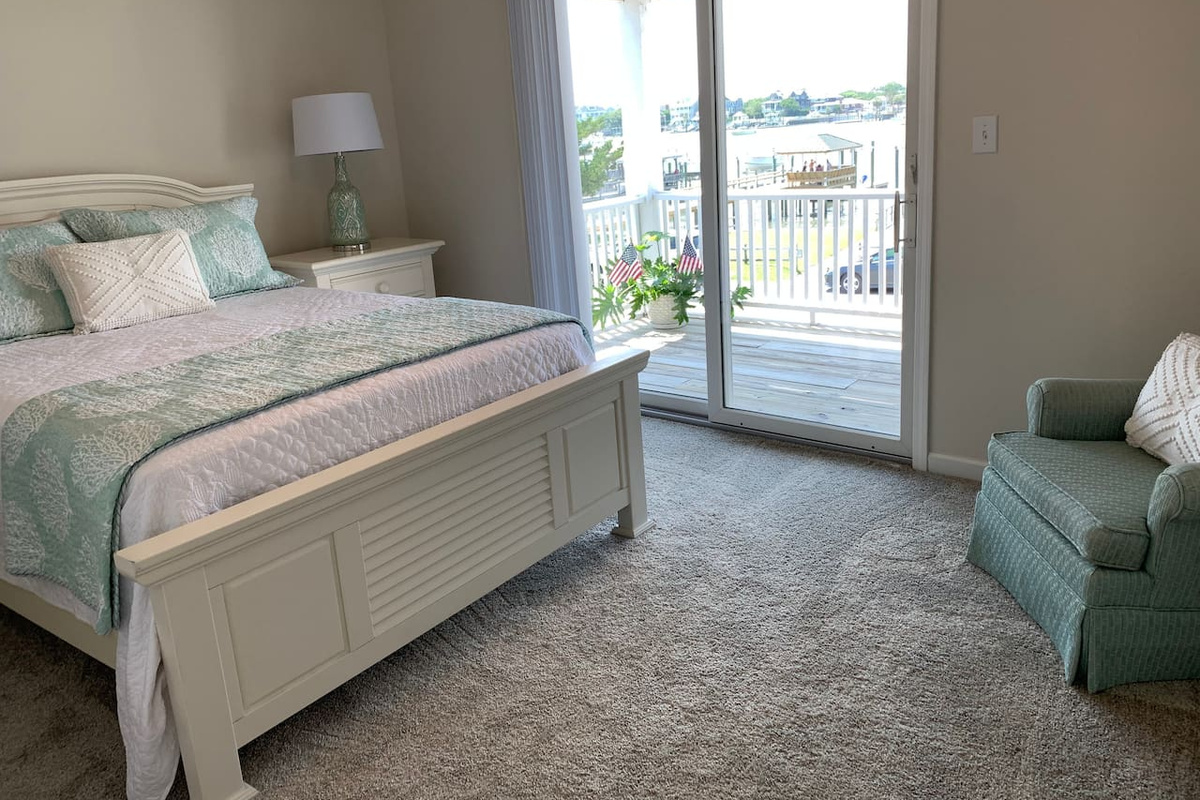 Master Bedroom with Waterfront Porch View and Access - Queen Bed