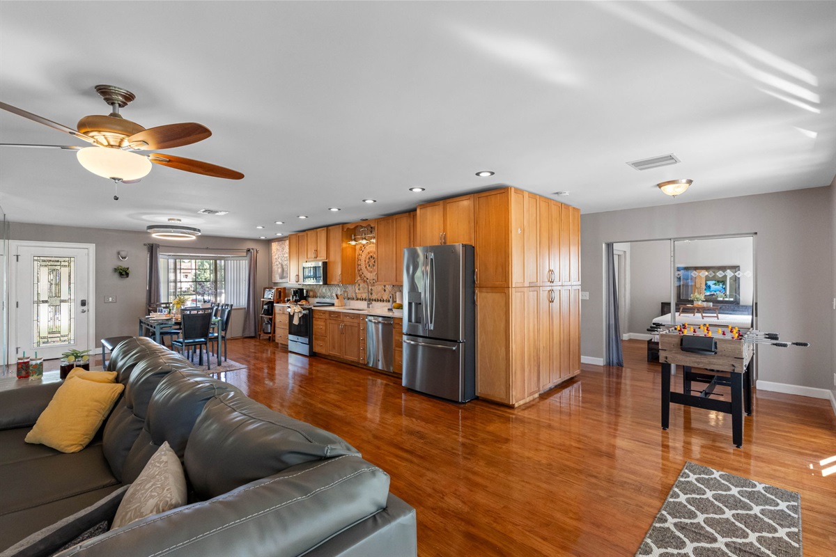 Flowing effortlessly into the kitchen and dining area, this living room offers a versatile layout for both daily living and gatherings.