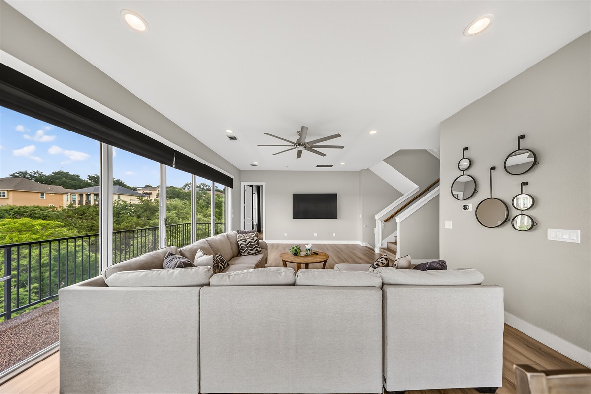 - Spacious living room with huge TV and panoramic lakeview windows - Cozy sectional seating supports movies relaxation and group fun - Bright open layout designed for easy comfort during your stay