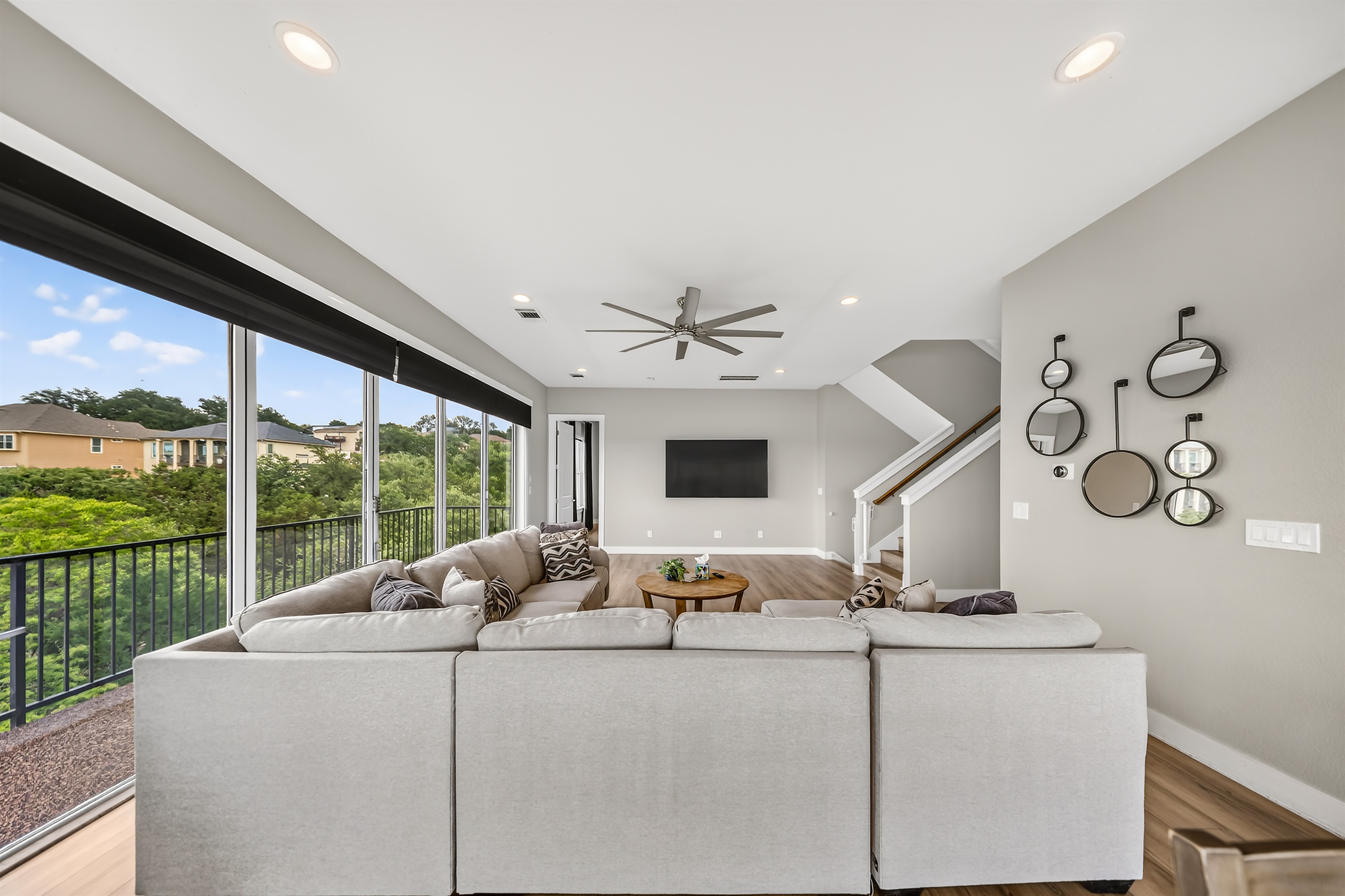 - Spacious living room with huge TV and panoramic lakeview windows - Cozy sectional seating supports movies relaxation and group fun - Bright open layout designed for easy comfort during your stay