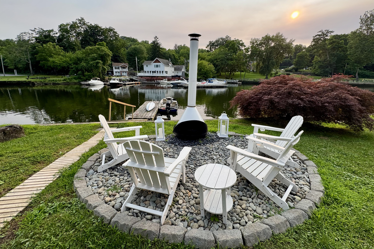 End the day around the iconic white chiminea as the river quietly drifts by.