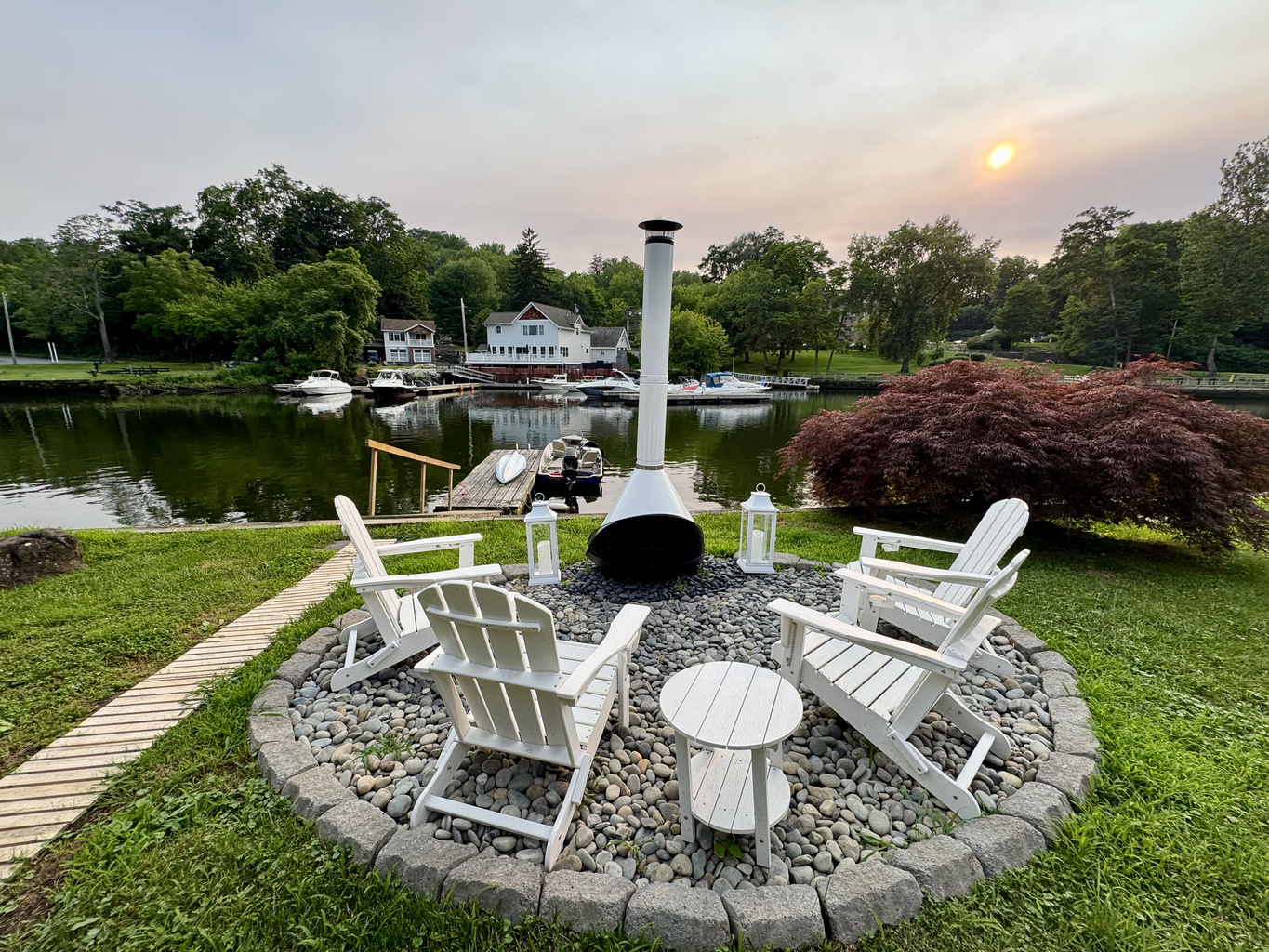 End the day around the iconic white chiminea as the river quietly drifts by.