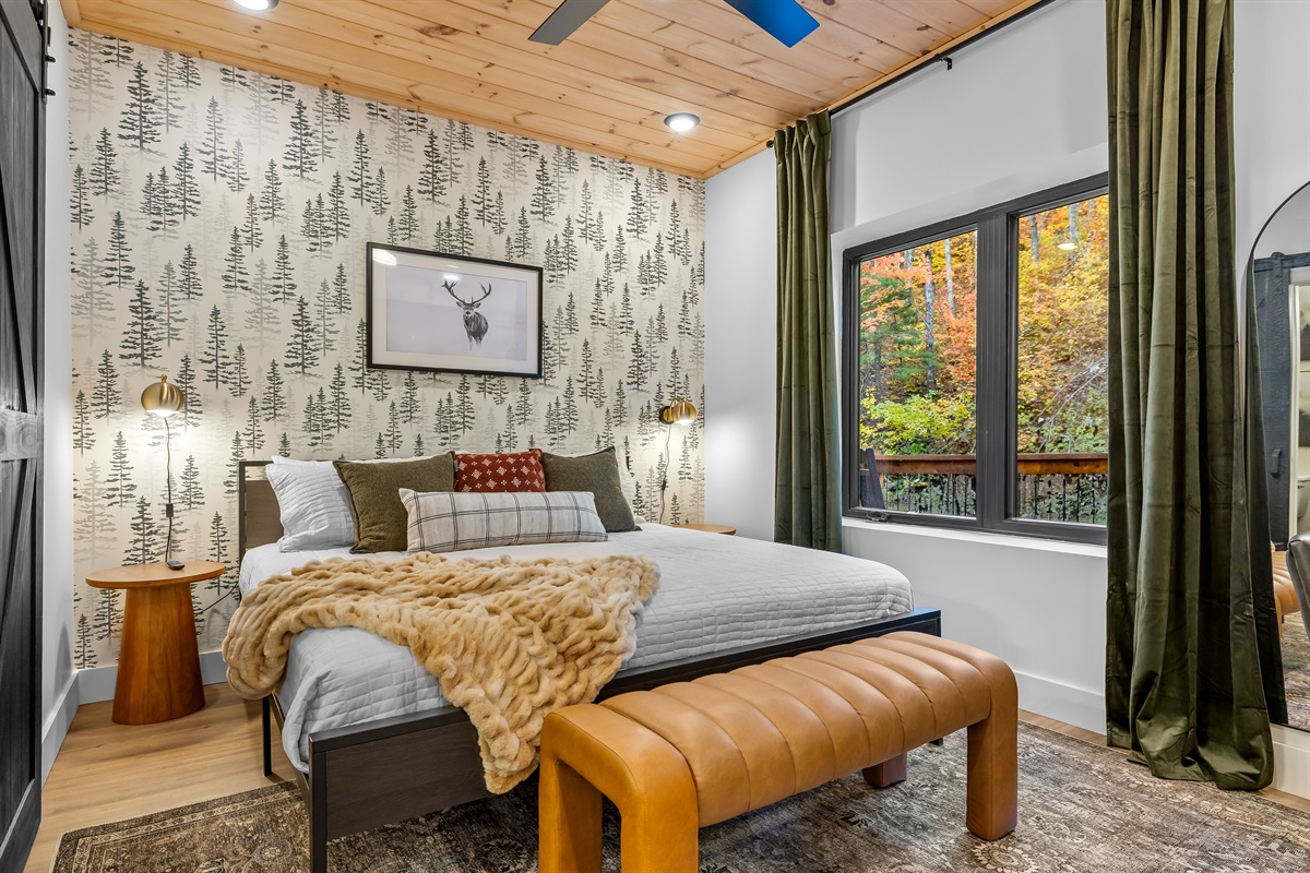 Main-level King Suite with calming, nature-inspired décor and desk