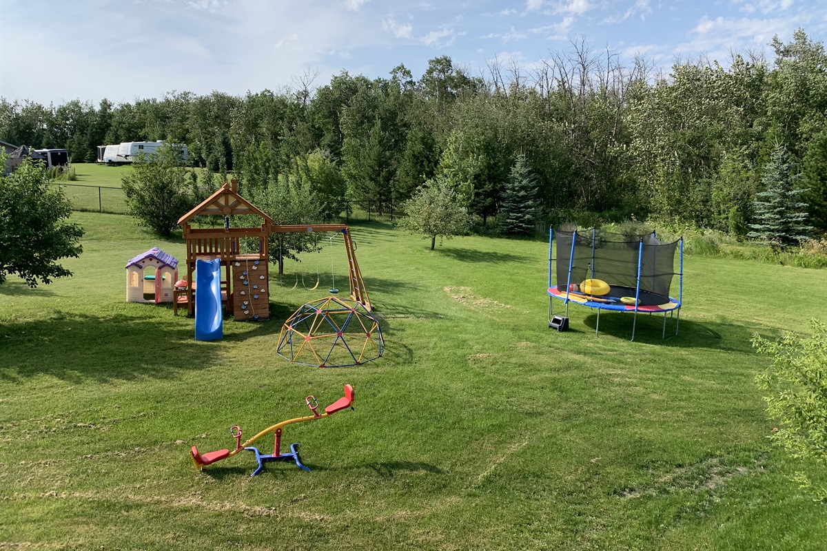 LOTS OF SPACE FOR YOUR LITTLE ONES TO PLAY. THE YARD IS NOT FENCED AND KIDS MUST BE SUPERVISED WHILE USING PLAYGROUND EQUIPMENT.