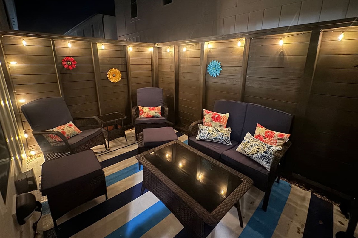 Grill with tools and bar cartColorful lounge seatingOutdoor shower Teak dining set for 8-10 available in front of unit (community amenity)Enclosed for pets w/ baby gates
