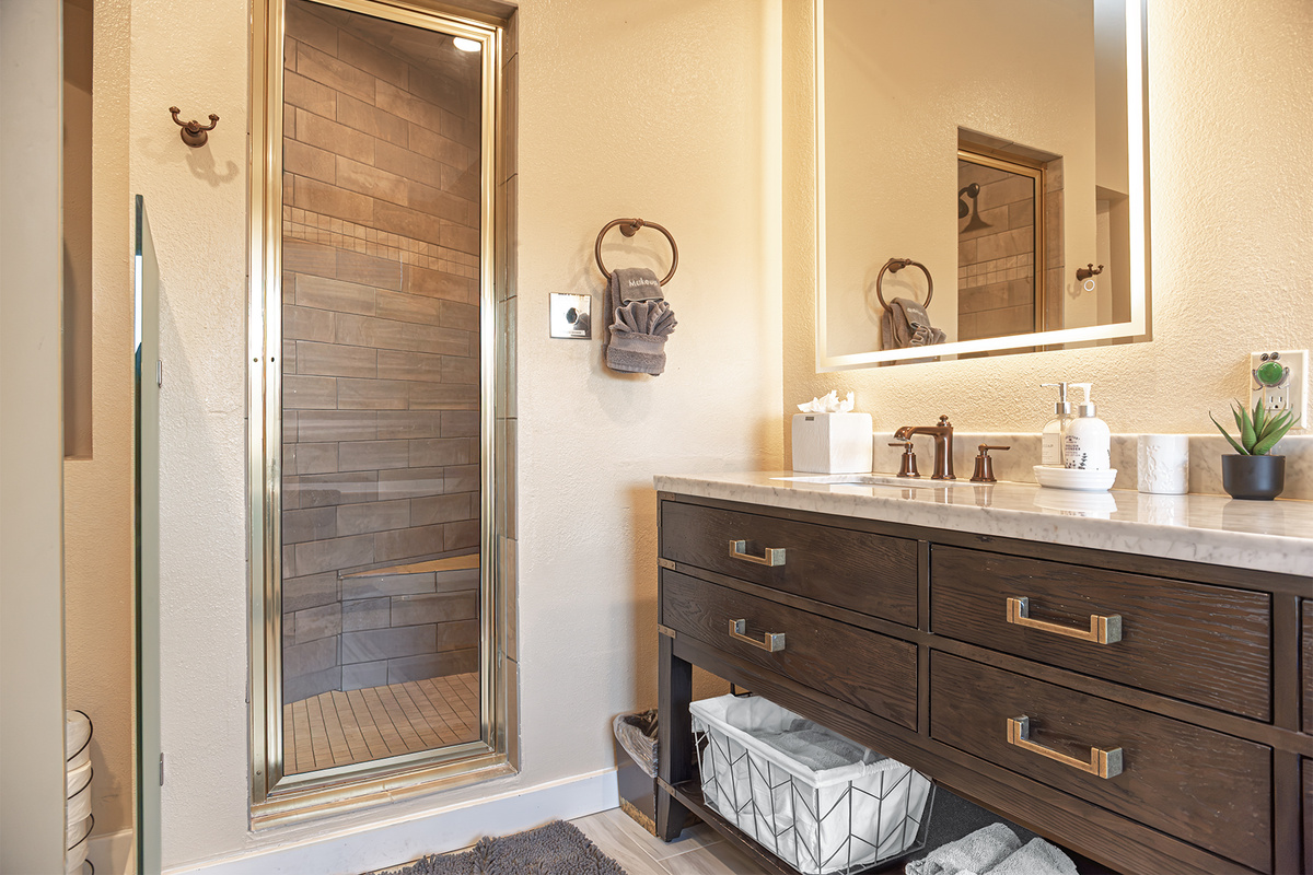 Comfort means a spectacular primary bath with walk-in shower and dual sink vanity.