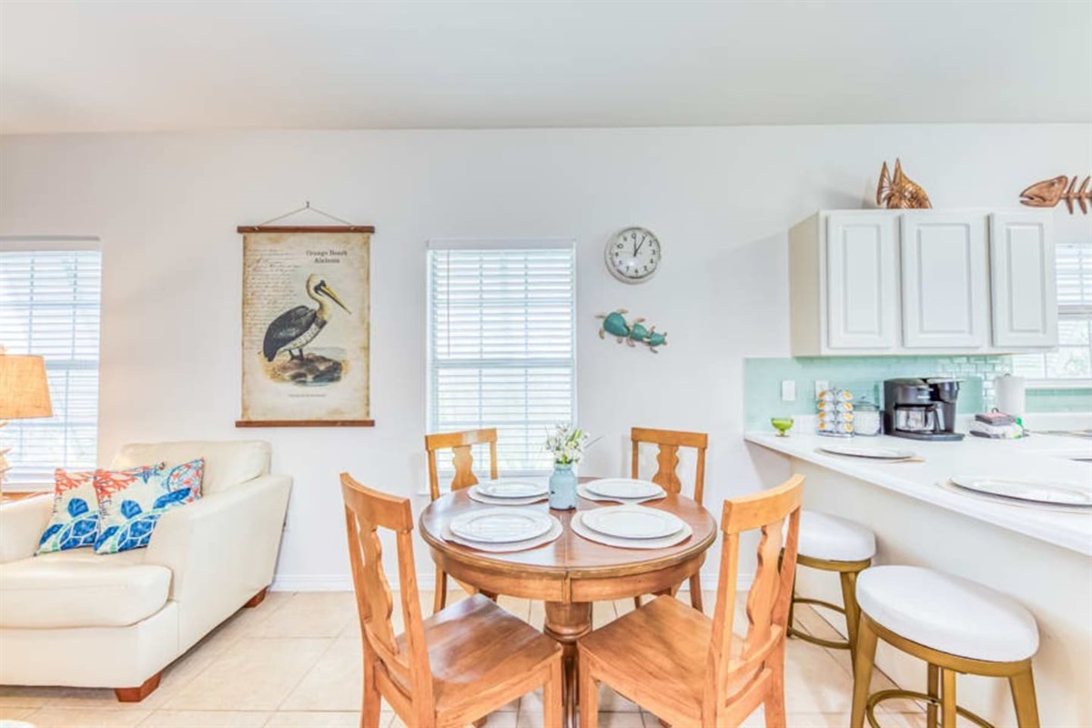 Dining Nook: Bright space awaits your culinary adventures with charming decor and beach vibes!