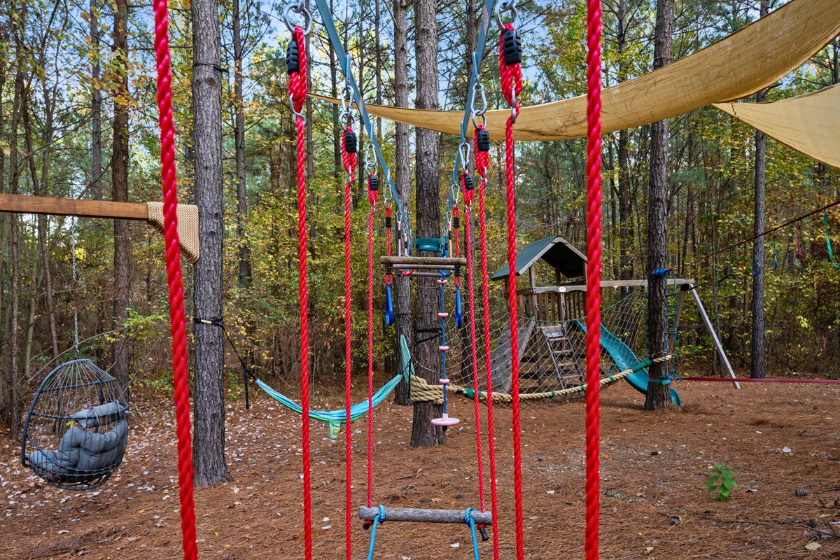 Bright colors and dangling ropes make this part of the play zone feel like a mini adventure every time kids run through it.