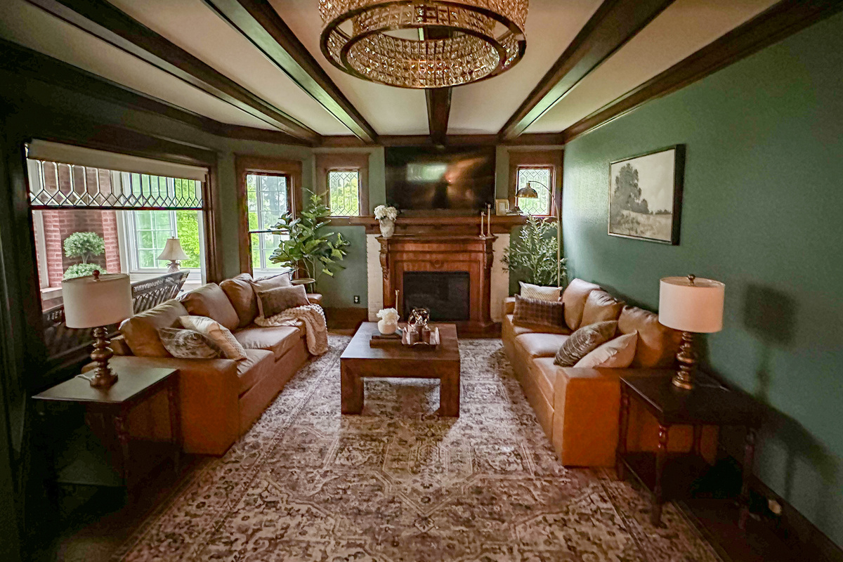 Gather beneath rich wood beams and cozy heritage inspired details in this warm, inviting living room designed for connection and relaxation. Unwind after a great day in a space that feels equal parts timeless and luxurious.