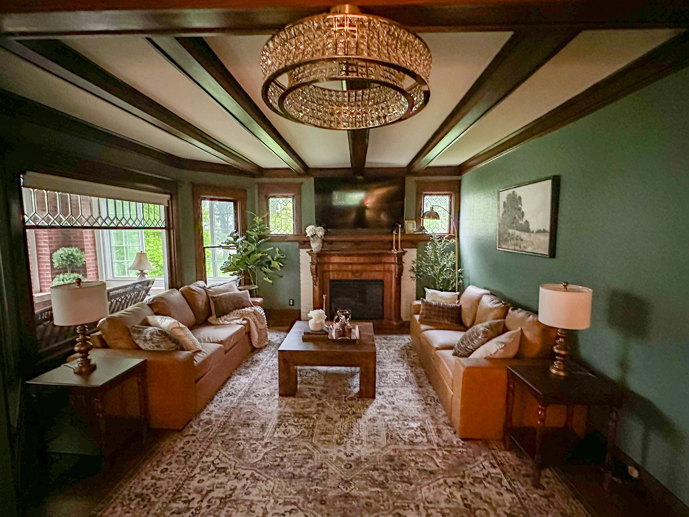 Gather beneath rich wood beams and cozy heritage inspired details in this warm, inviting living room designed for connection and relaxation. Unwind after a great day in a space that feels equal parts timeless and luxurious.