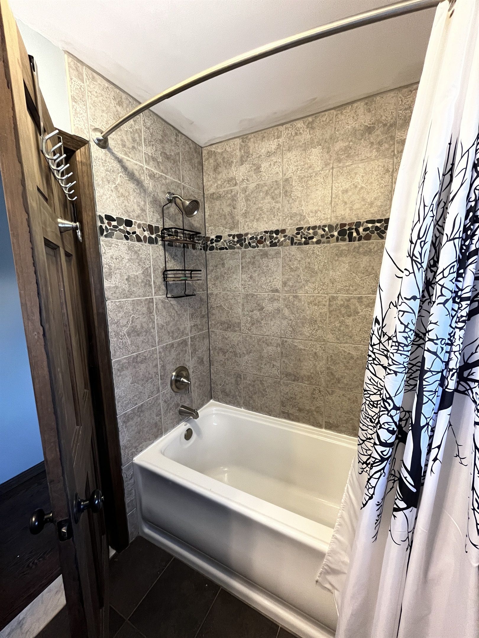 bath with tub/shower off hallway