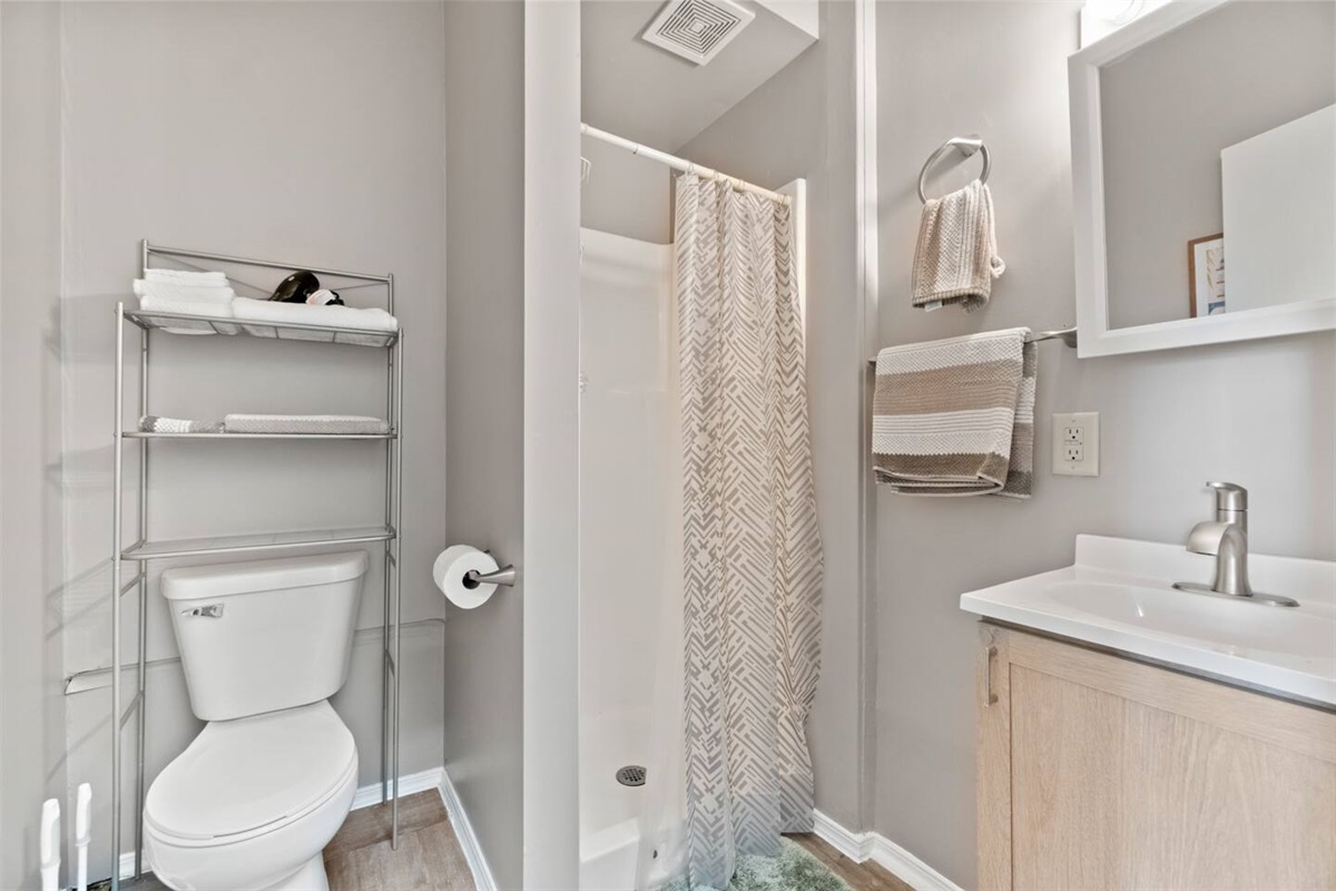 Sparkling clean full bathroom, thoughtfully stocked with essentials for your convenience.