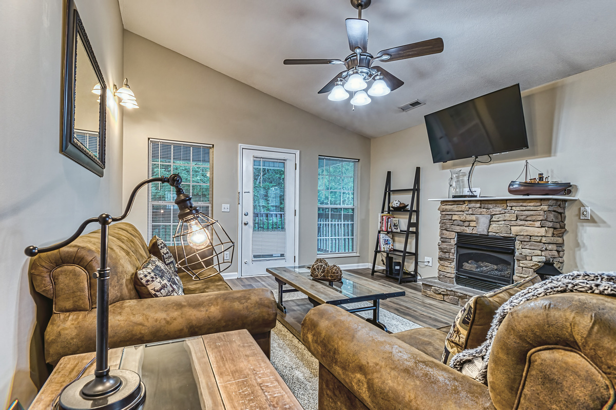 Living room, gas fireplace, and the door to the deck.