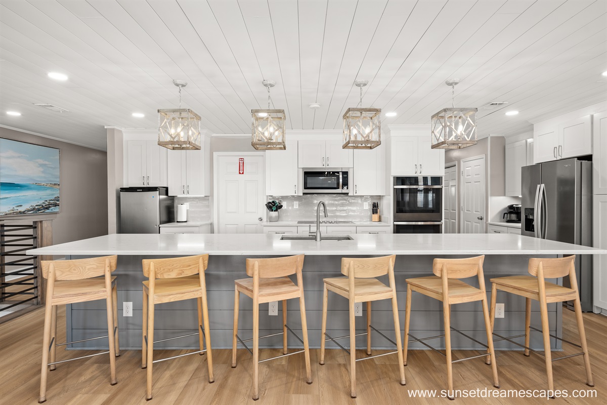 Two fridges! A full-size refrigerator/freezer combination may be seen in the right side of this photo, while a smaller drink refrigerator is located on the left side of this photo. The cooks and beach-goers alike will enjoy the added cooling space.