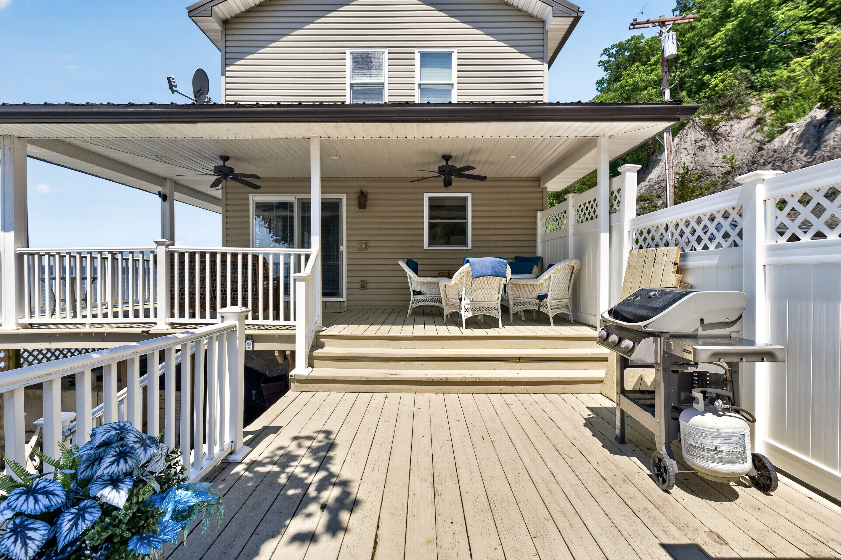 Deck with dining set and gas grill