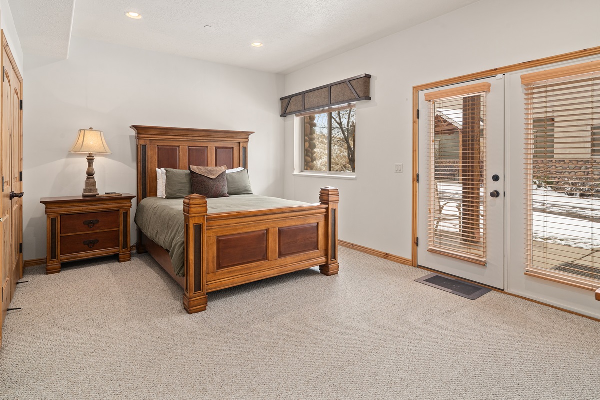 Bright bedroom with outdoor access and large windows