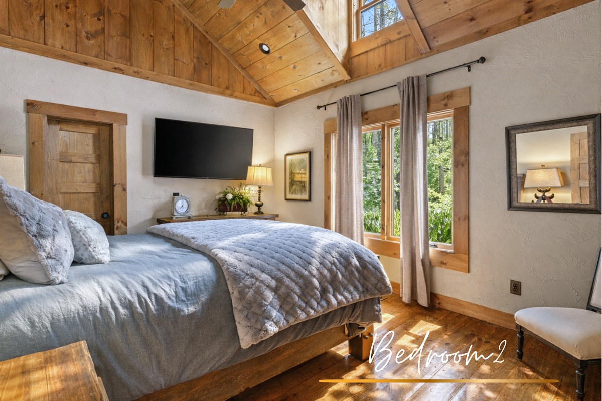 Bedroom 2: This inviting queen bedroom offers soft linens, natural light, and tranquil views, making it the perfect spot to recharge after a day of adventure