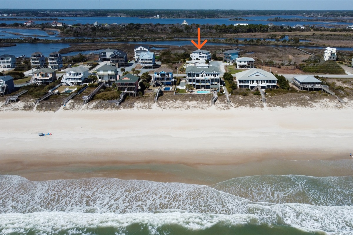 Soundside Solace location with surrounding homes, beach, and ocean
