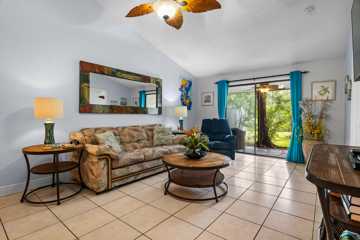 Family room connects to the back screened in patio.