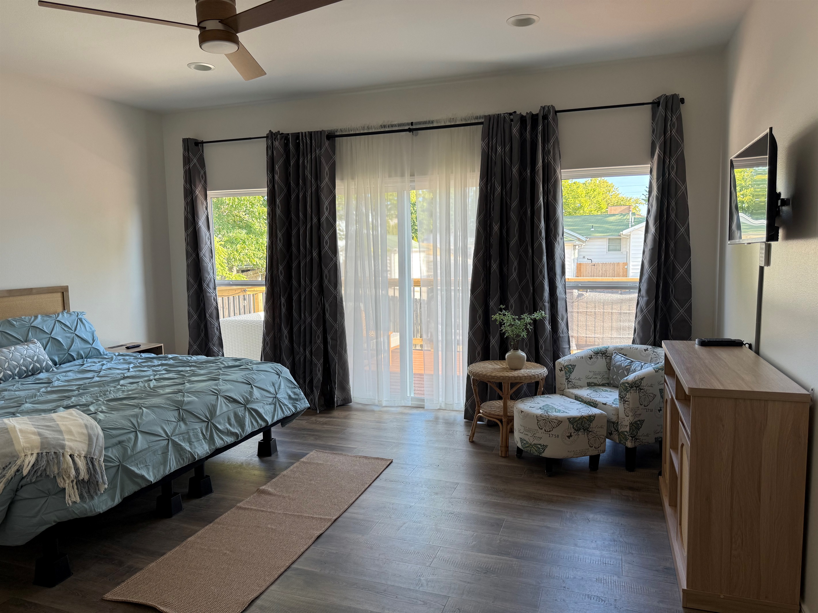 Master Bedroom overlooking furnished upper deck that covers entire length of rear elevation