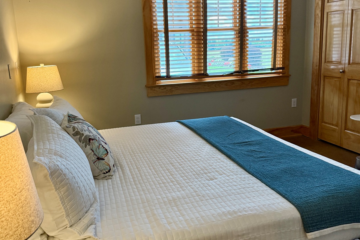 This king bedroom on the lower level also has a twin daybed for additional sleeping quarters. Catch your views of the bay and Torch Lake below!