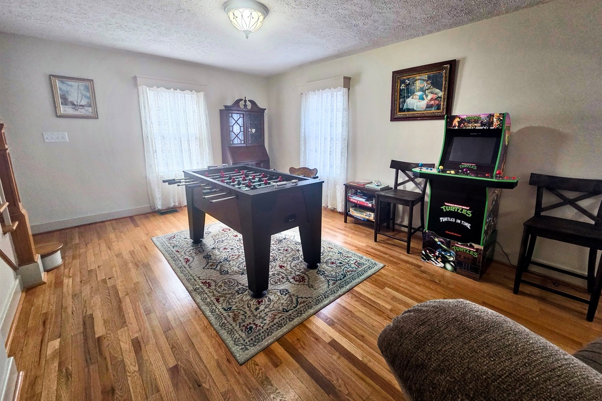 A dedicated game room area offers the perfect spot for friendly competition and evening entertainment.