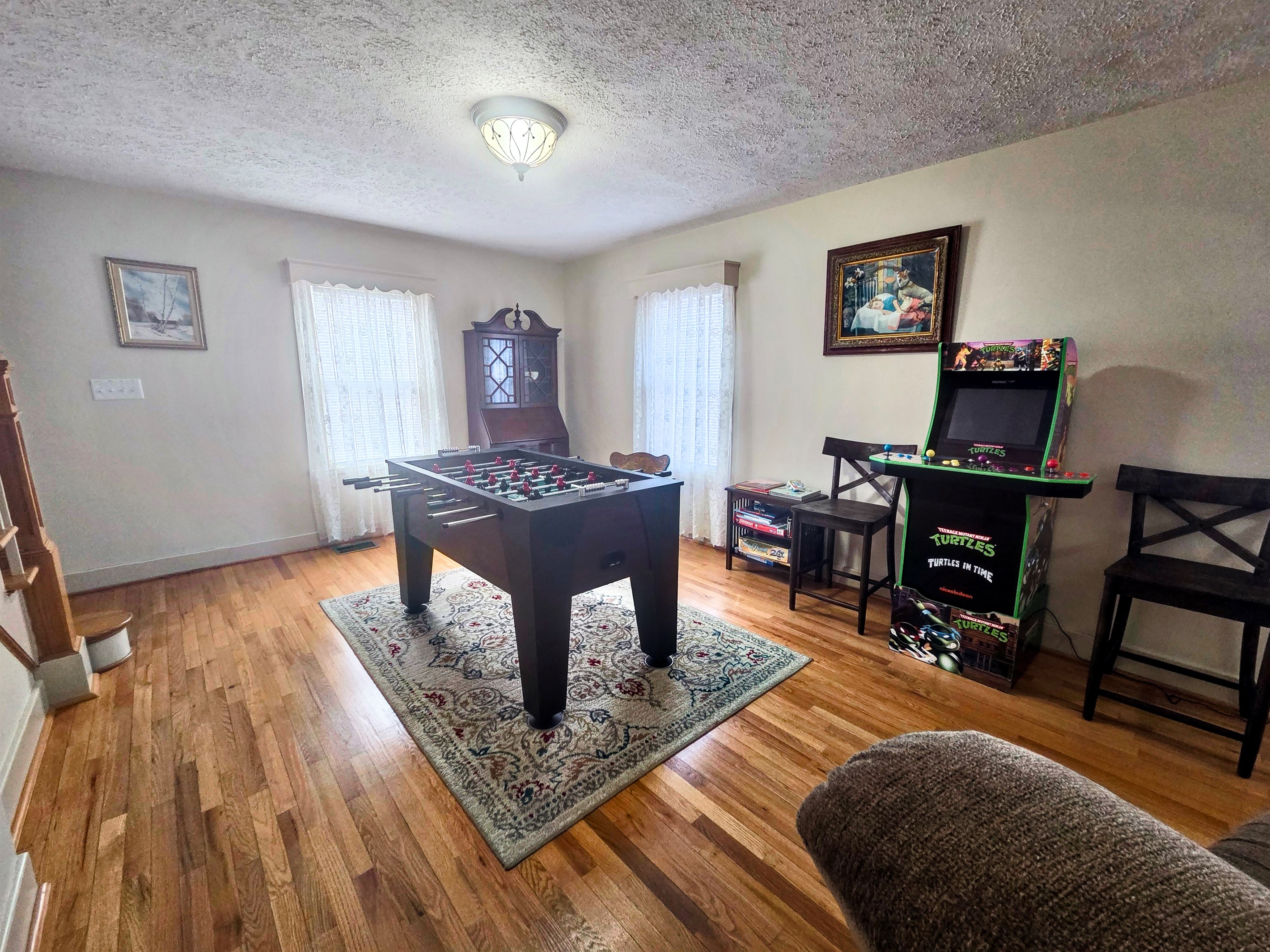 A dedicated game room area offers the perfect spot for friendly competition and evening entertainment.