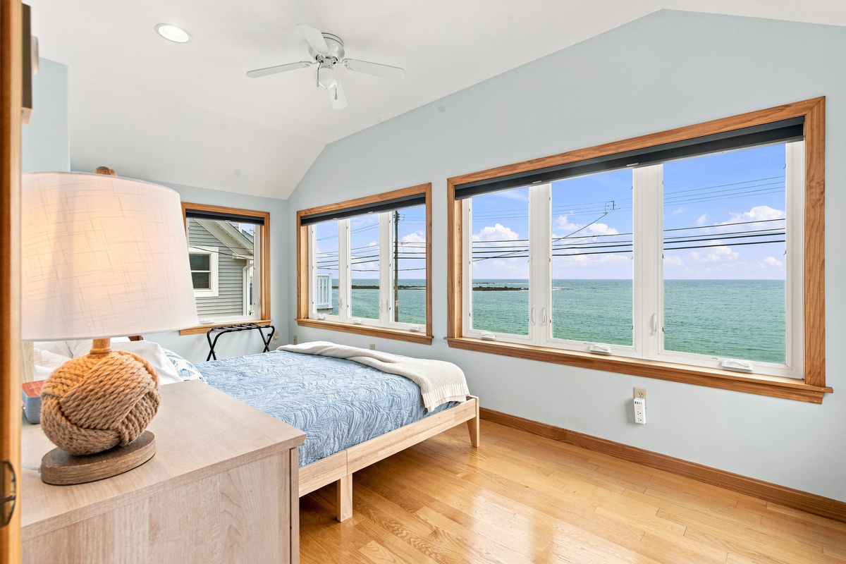 Wake up to breathtaking ocean views from this bright and spacious bedroom.