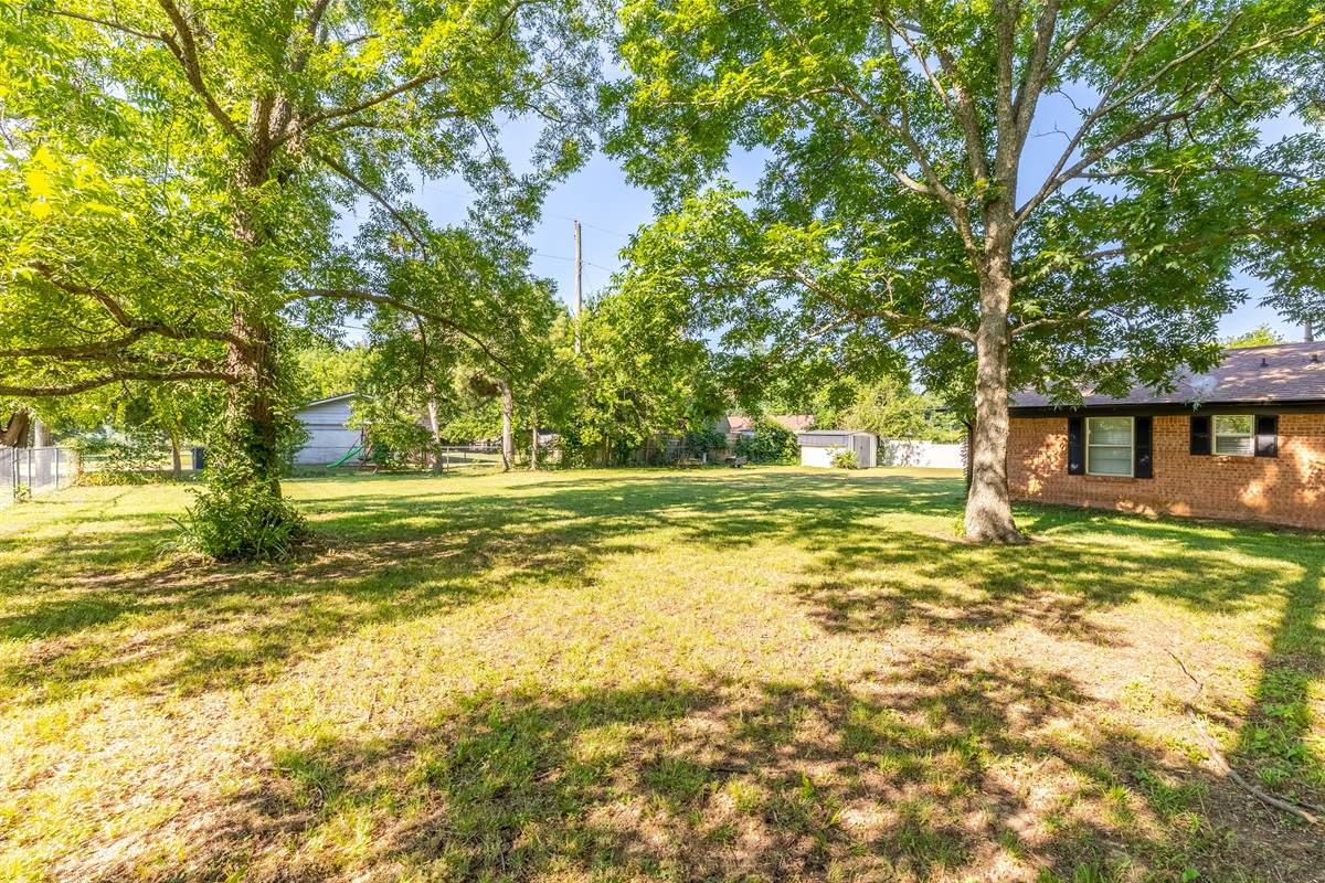 Spacious fenced yard for relaxation and play.