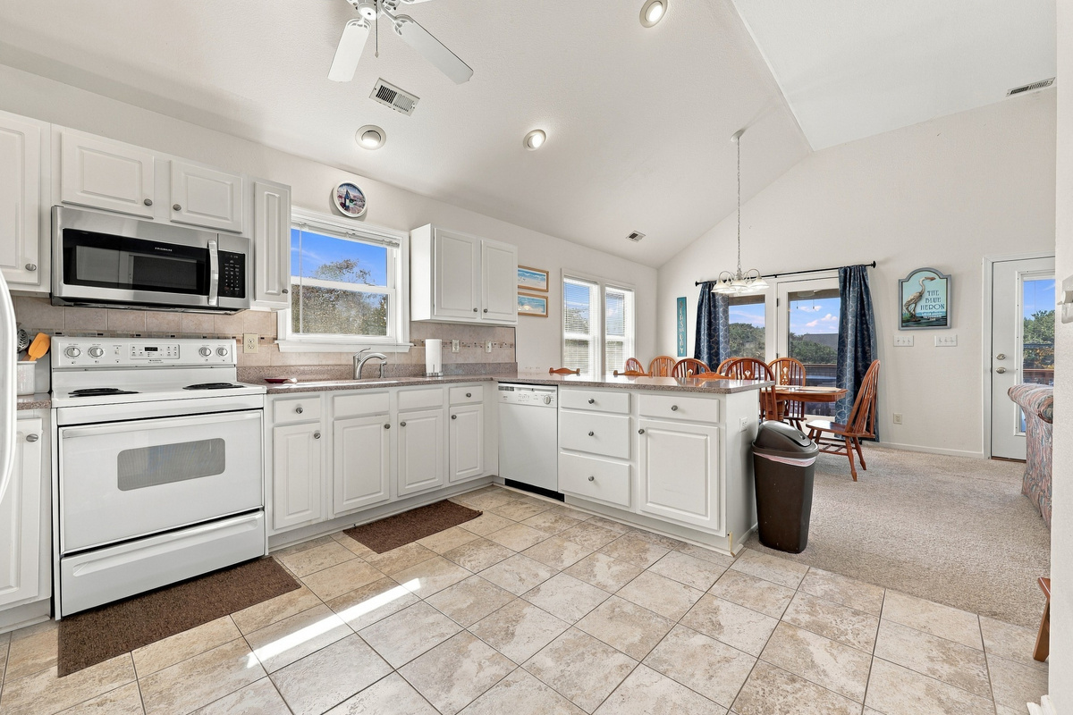 Lots of counter space, a dishwasher and a sunny window over the sink.