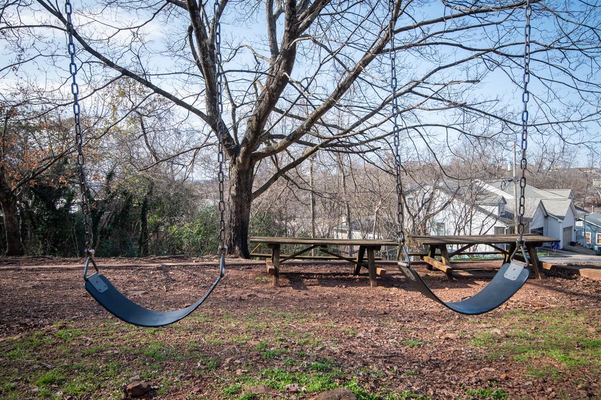 Another look at the quaint park next to the property complete with swings, picnic tables, and a slide!